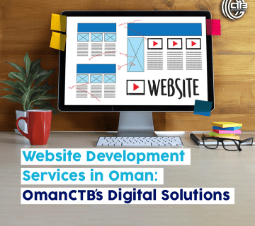 Computer on a desk displaying "Website" on the monitor, surrounded by glasses, a plant, and a cup, illustrating website development services in Oman by OmanCTB.