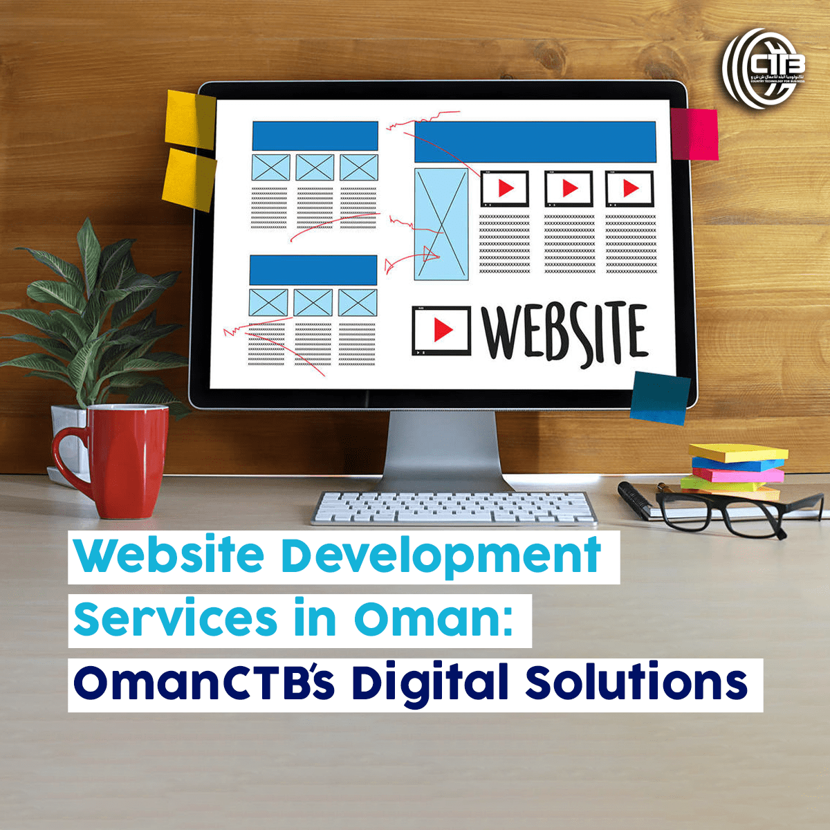 Computer on a desk displaying "Website" on the monitor, surrounded by glasses, a plant, and a cup, illustrating website development services in Oman by OmanCTB.